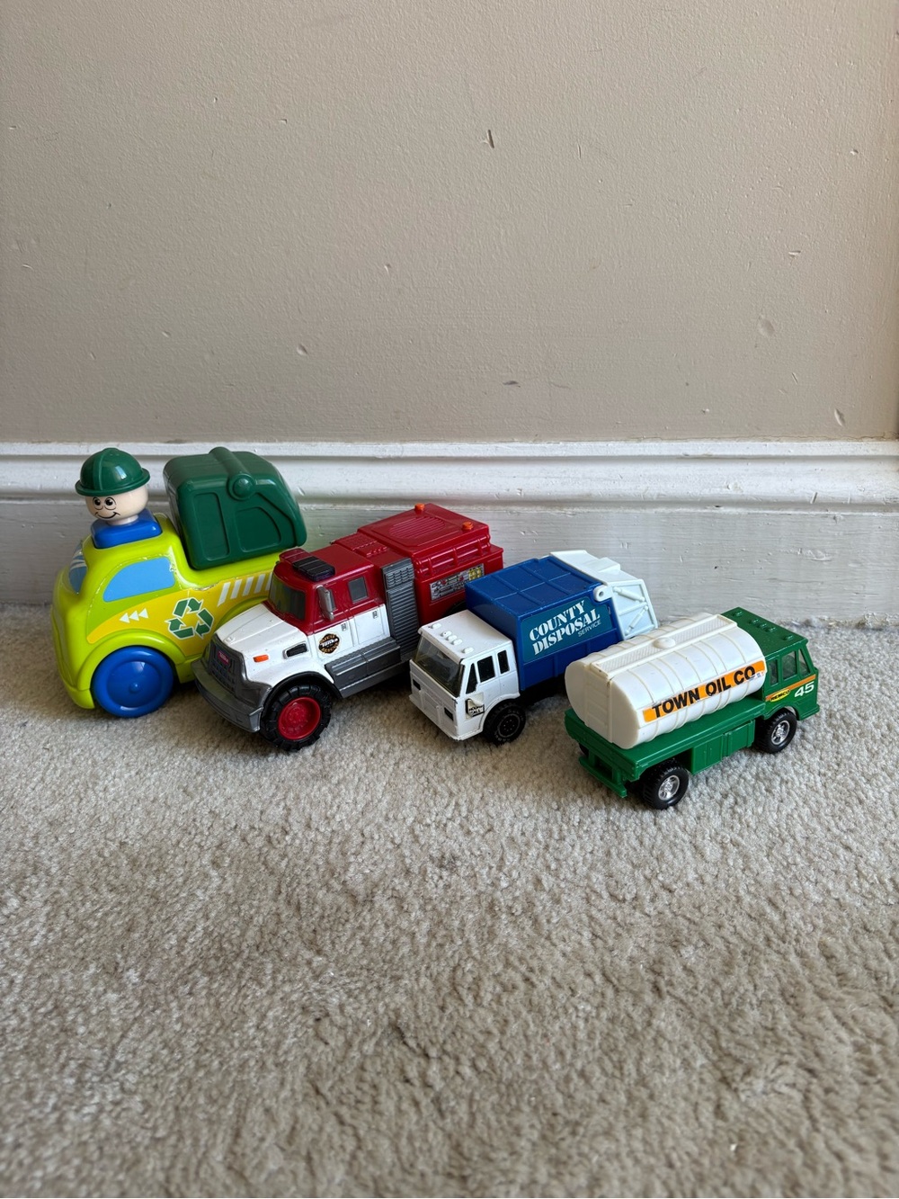 Lot of 4 play trucks for toddlers